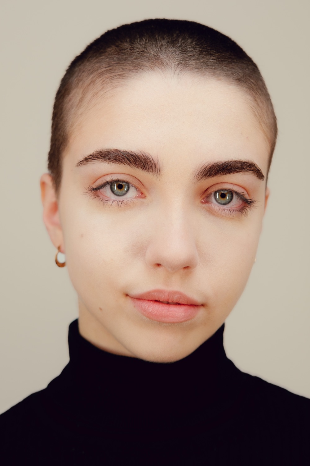Studio portrait of Victoria looking directly at the camera